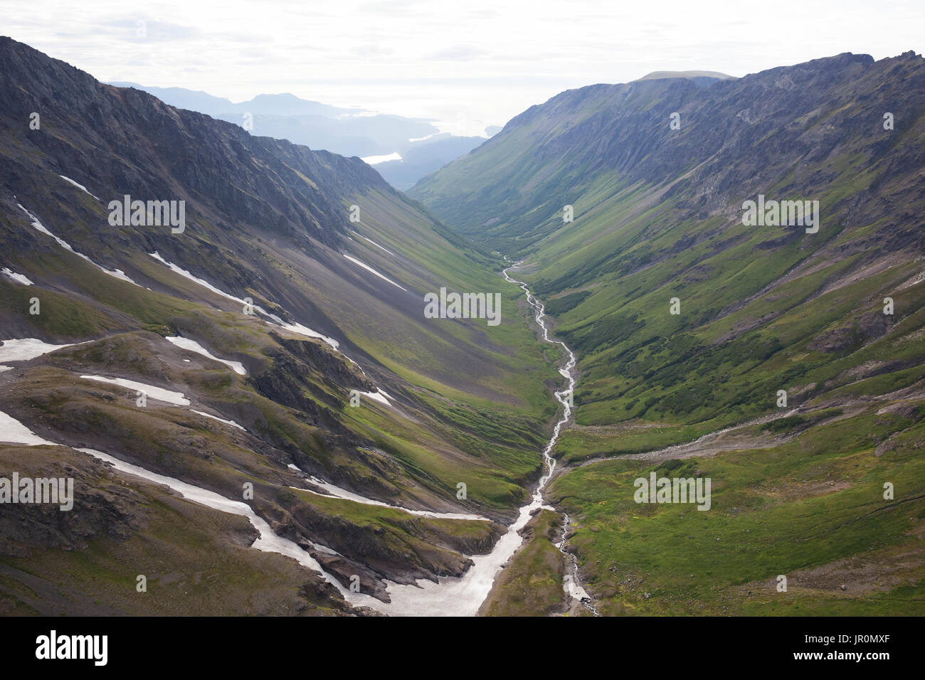 A River Running Through A Valley In The Kenai Mountains, Kachemak Bay State Park; Alaska, United States Of America Stock Photo