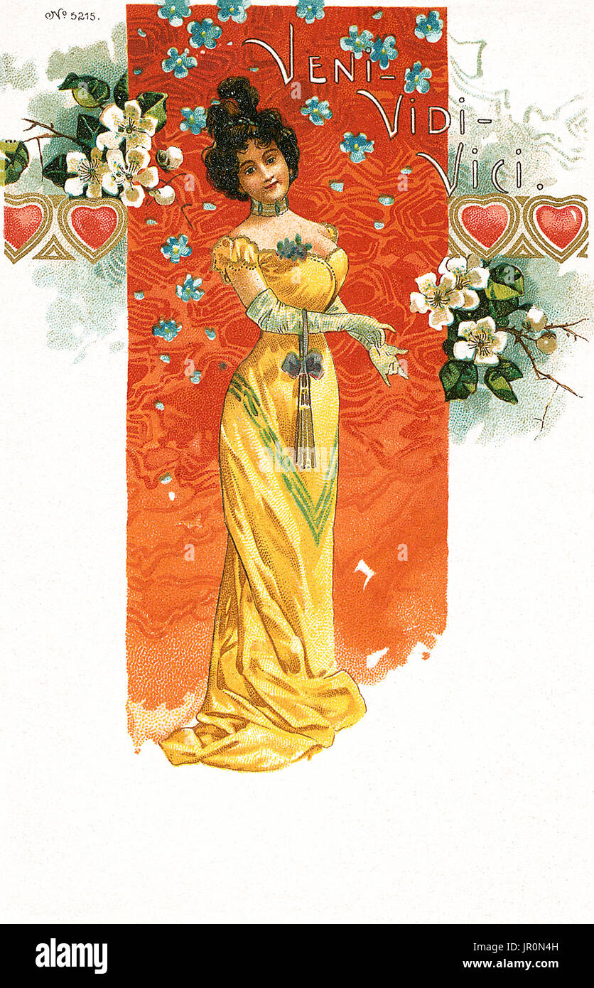 Early 20th century art nouveau postcard of an Edwardian lady in a yellow dress, inscribed with the words, 'Veni Vidi, Vici.' Stock Photo