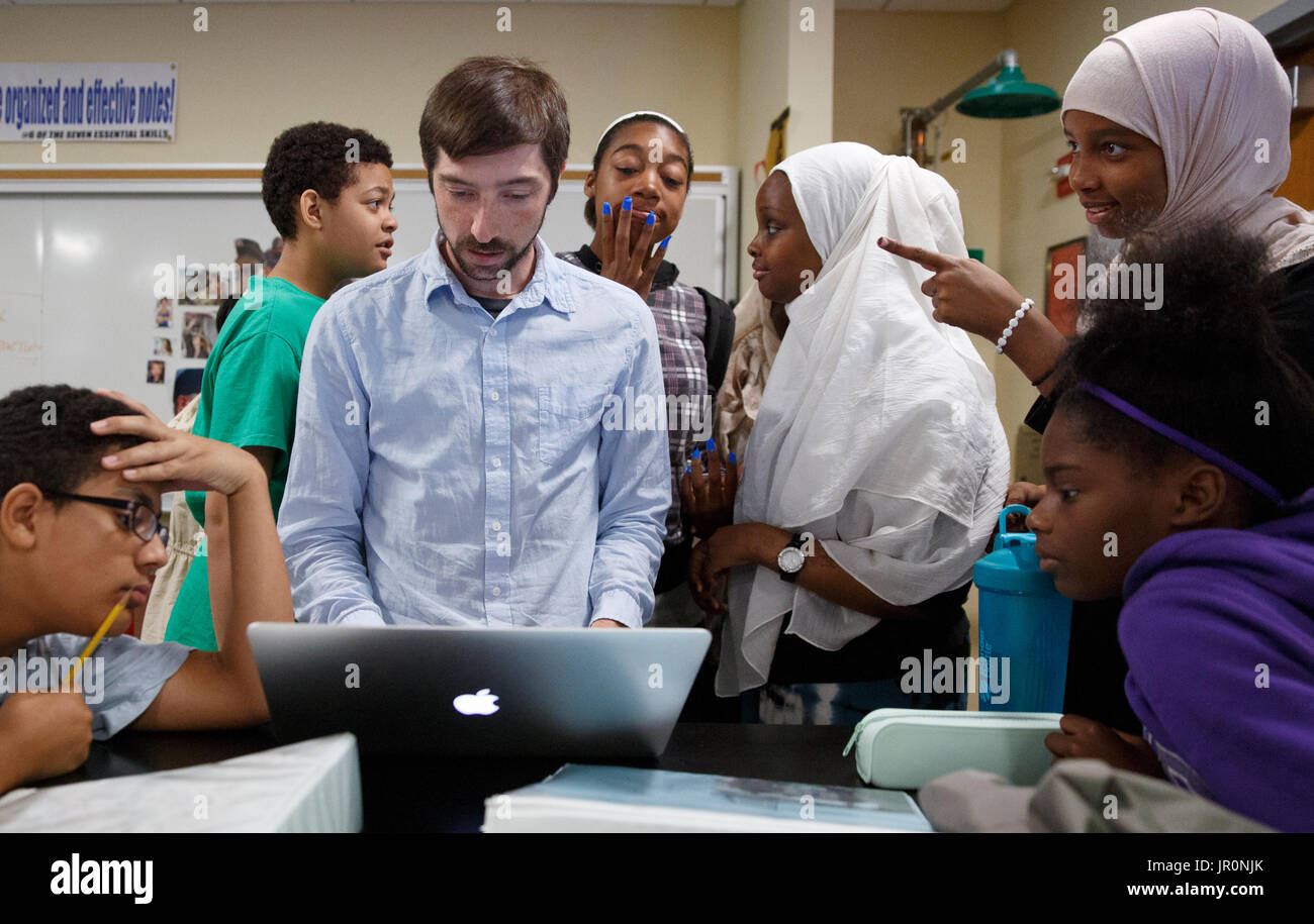 High school science teacher and students in class Massachusetts Stock