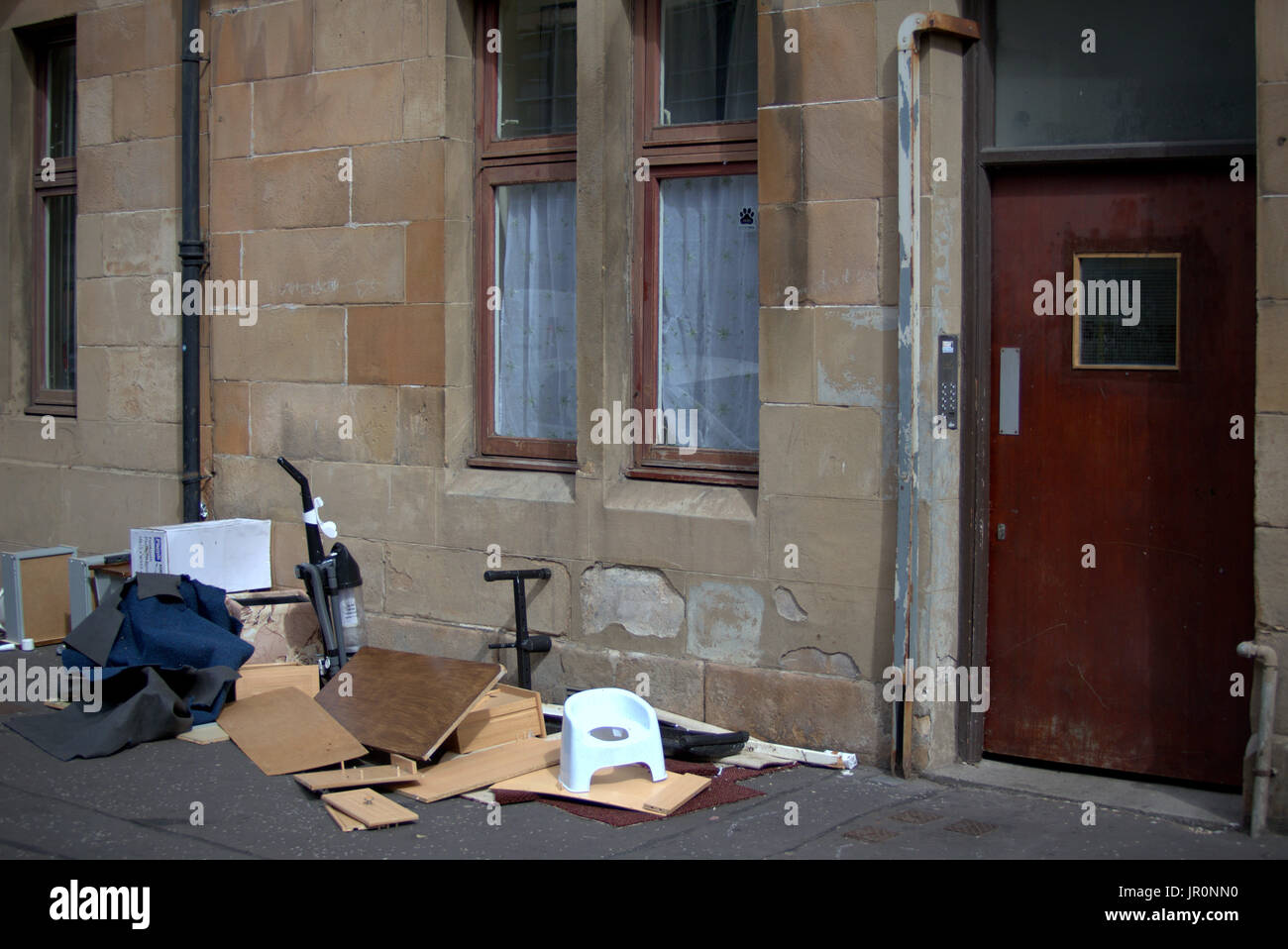 Govanhill Glasgow fly tipping rubbish on street Stock Photo