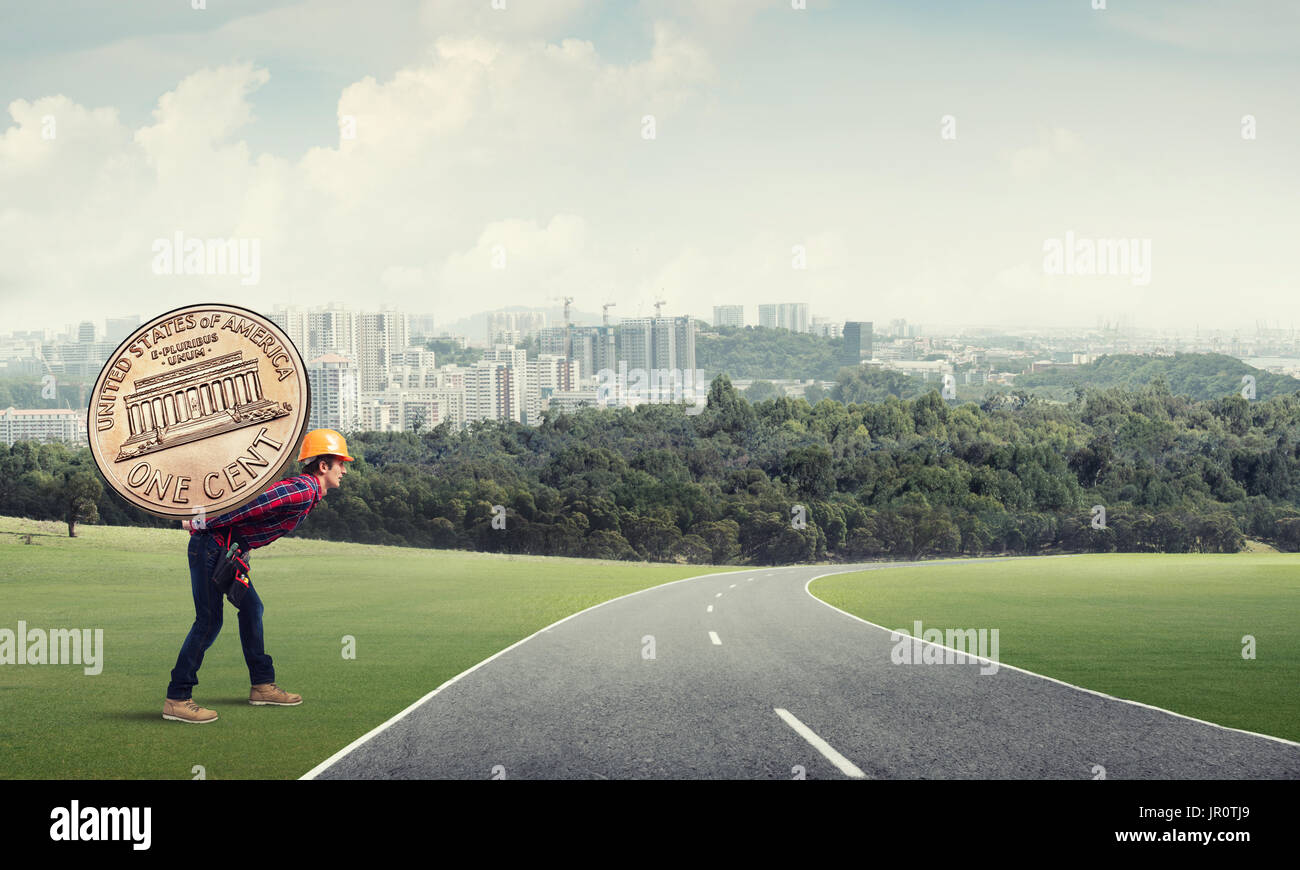 Builder man carry coin Stock Photo Alamy