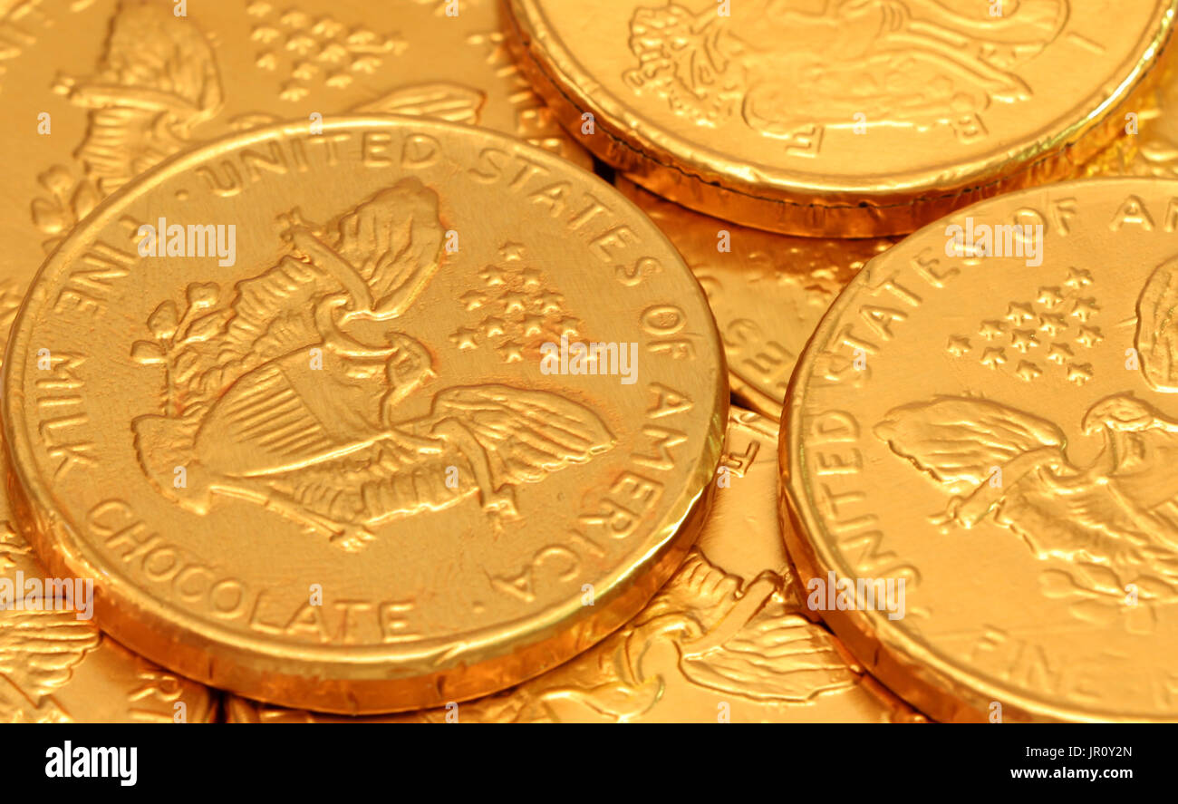 A background of gold chocolate coins Stock Photo