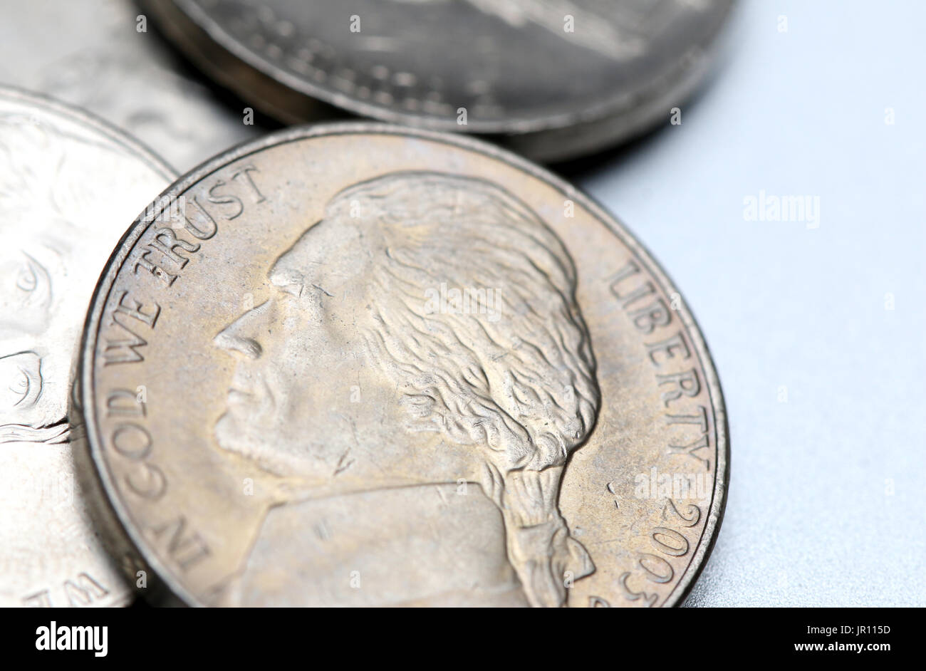Nickels isolated on a silver background Stock Photo Alamy