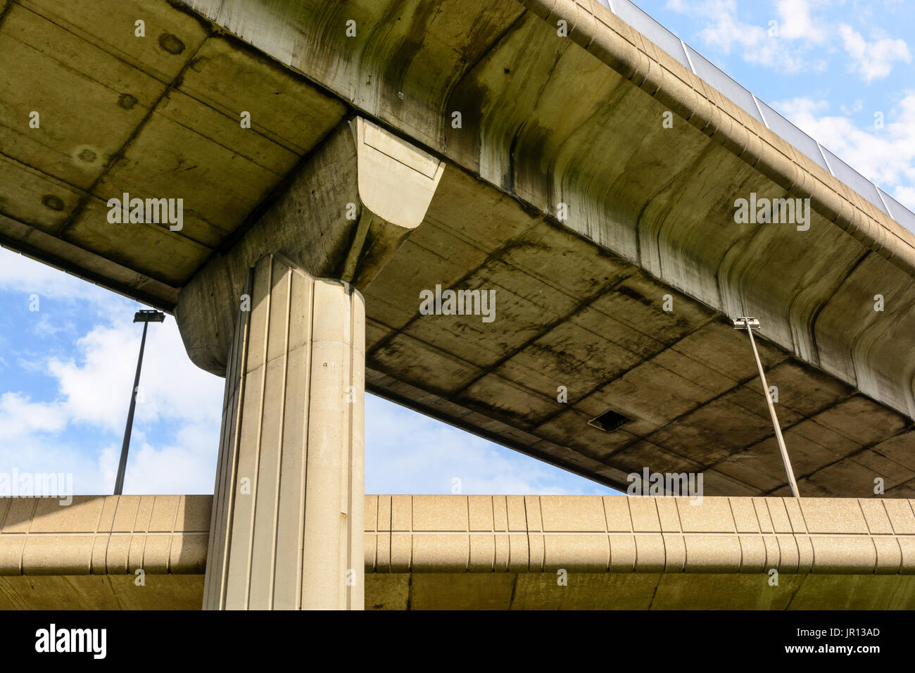 View from below of two highway junctions crossing one above the other. Stock Photo
