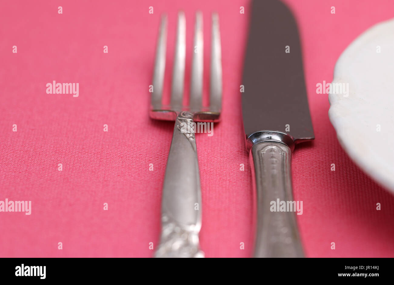 A place setting of vintage china and cutlery Stock Photo Alamy
