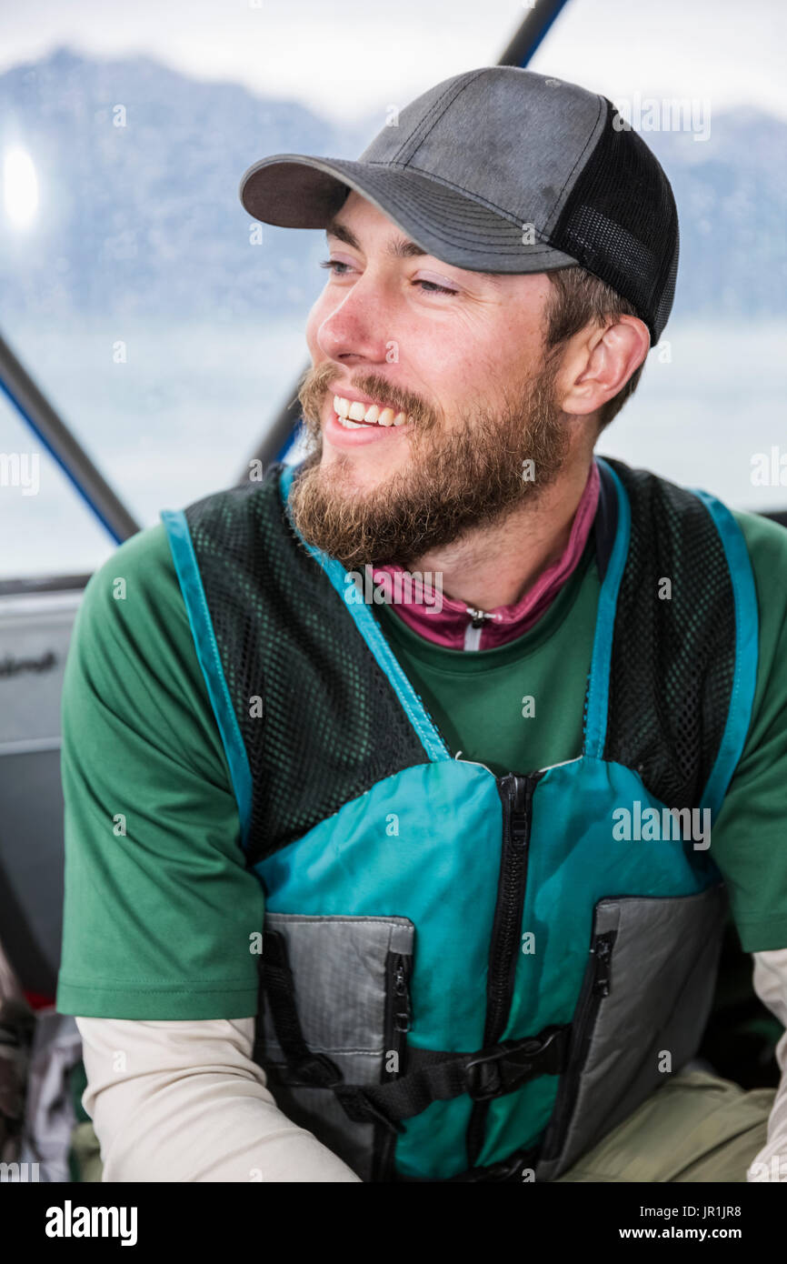 Tourist On Boat Wearing A Life Vest, Seward, Southcentral Alaska, USA Stock Photo
