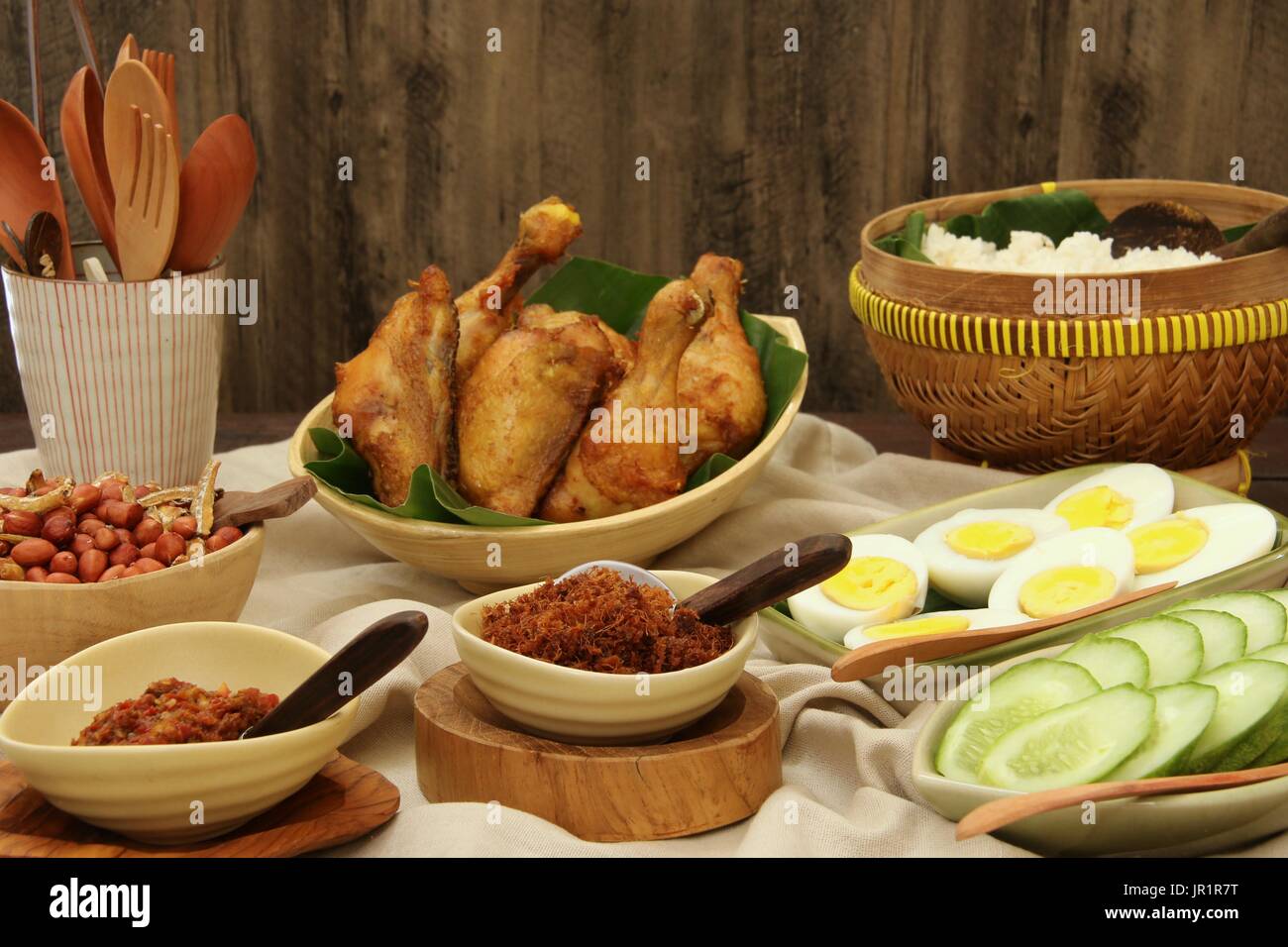 Nasi Lemak, Malaysian Savory Rice Dish with Fried Chicken, Egg, Peanuts