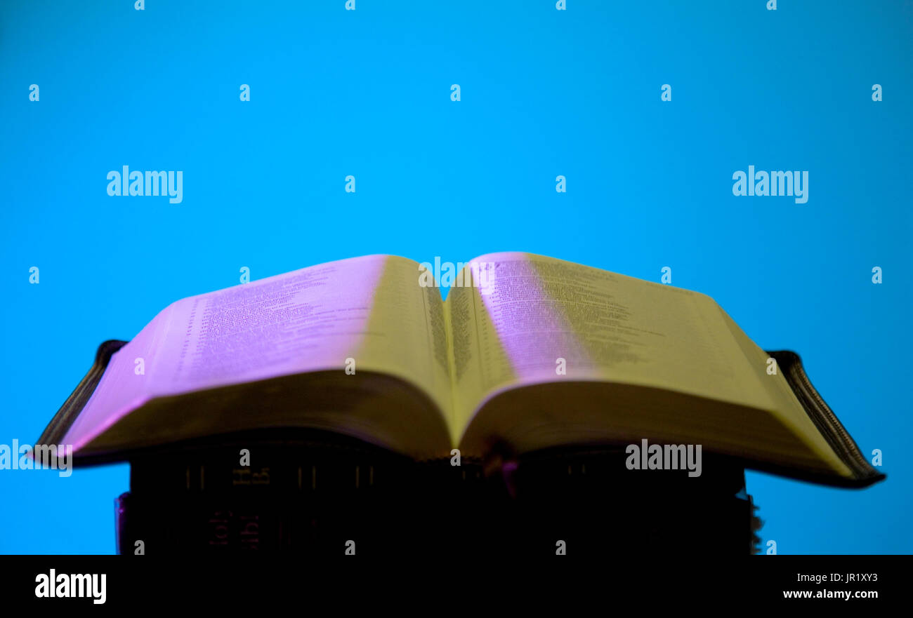 Dynamically Light Open Bible with Copy Space for Writing Stock Photo