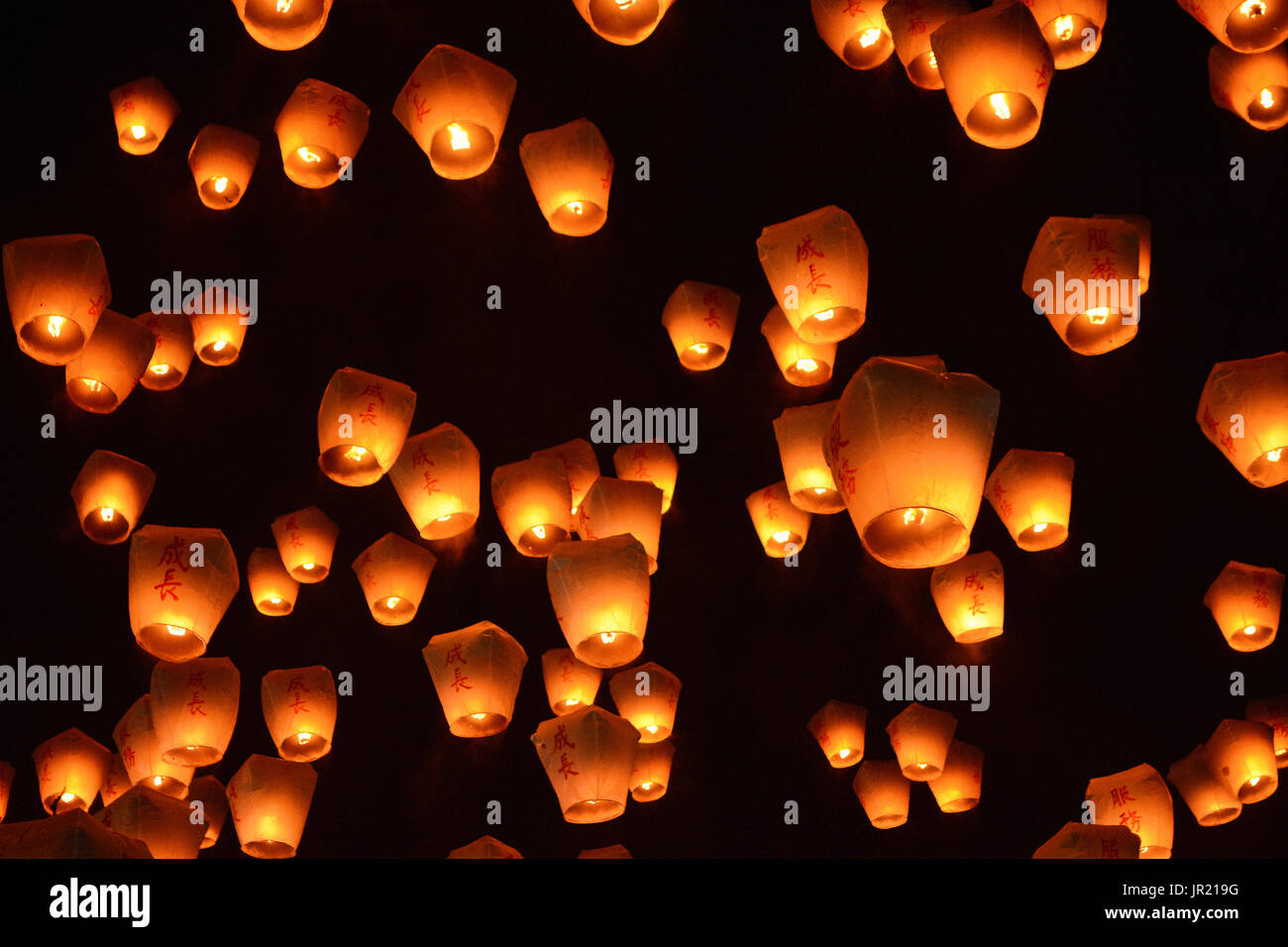 Thousands of lanterns fill the sky at the 2017 Pingxi Sky Lantern Festival in Taiwan, the Chinese text on them says chengzhang, which means to grow Stock Photo