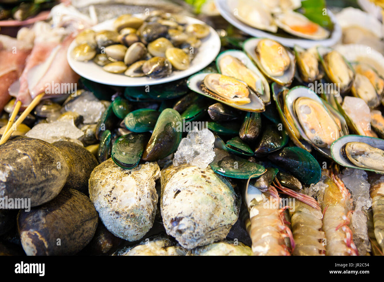 Fresh shellfish seafood at a local market in Phuket, Thailand. Stock Photo