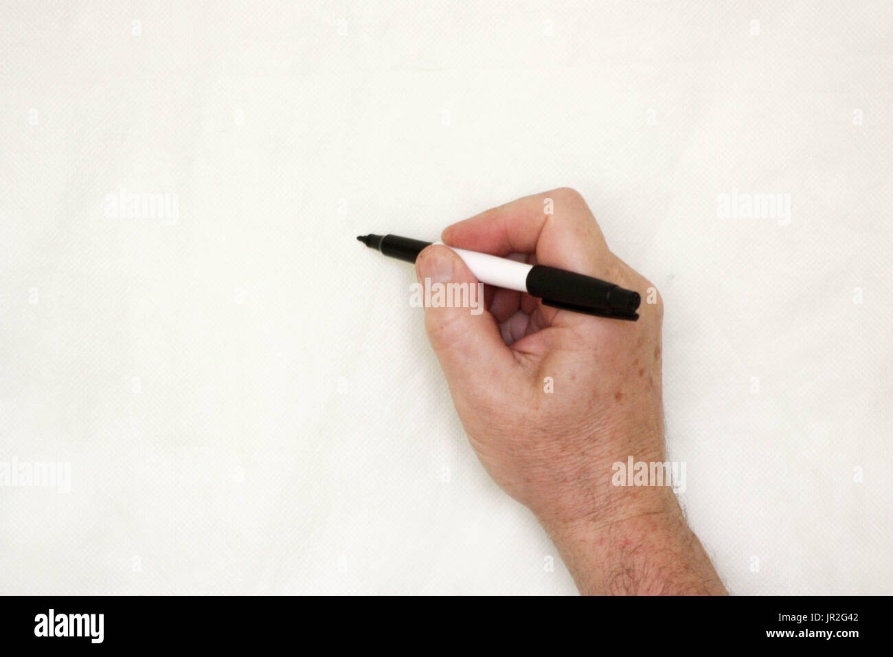 Hand and marker. A man's hand holds Stock Photo - Alamy