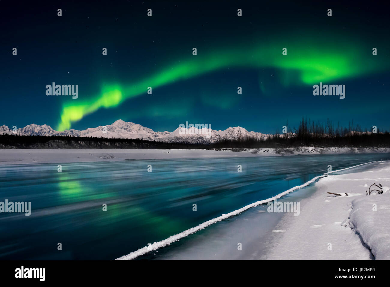 Green Aurora Borealis Arch Over The Chulitna River With Denali And The Alaska Range In The Background, Denali State Park, Southcentral Alaska, USA Stock Photo