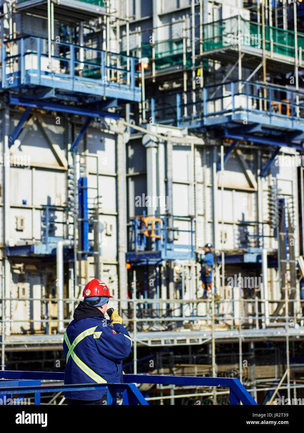 Tradesman Working At A Refinery; Edmonton, Alberta, Canada Stock Photo