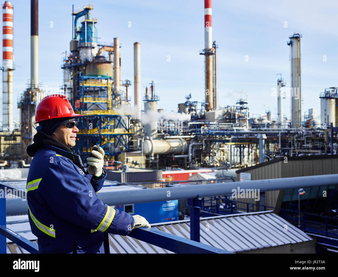 Tradesman Working At A Refinery; Edmonton, Alberta, Canada Stock Photo