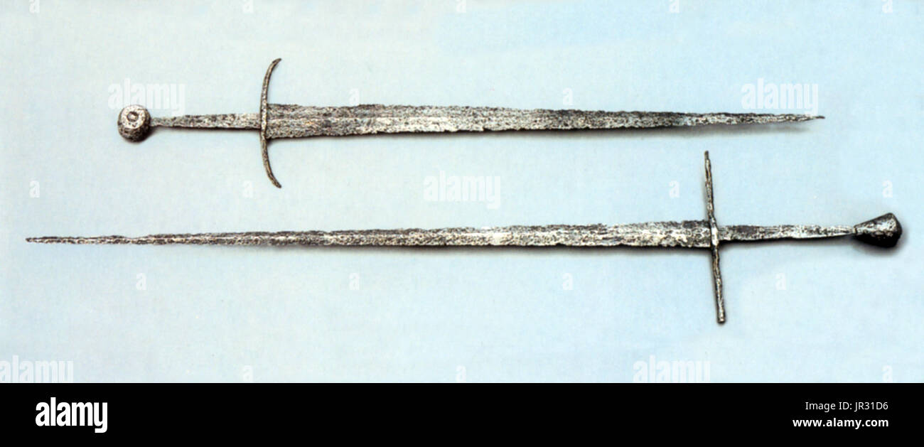 The Arming sword (Knightly sword) was the most widespread type of sword in the European High Middle Ages. It was a straight, double-edged weapon with a single-handed cruciform hilt and a blade length of about 28 to 31 inches. The type is frequently depicted in period artwork, and numerous examples have been preserved archeologically. The high medieval sword of the Romanesque period (10th-13th centuries) develops gradually from the Carolingian sword (spatha) of the 9th century. In the Late Medieval period (14th and 15th centuries), late forms of these swords continued to be used, but often as a Stock Photo