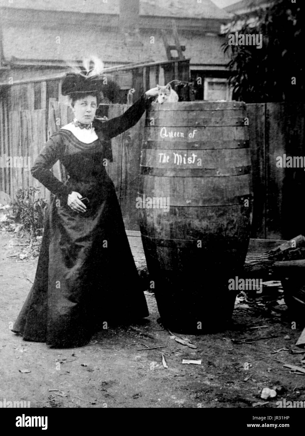 Annie Edson Taylor (October 24, 1838 - April 29, 1921) was an American teacher. Desiring to secure her later years financially, she decided she would be the first person to ride over Niagara Falls in a barrel. Taylor used a custom-made barrel for her trip, constructed of oak and iron and padded with a mattress. On October 24, 1901, her 63rd birthday, the barrel was put over the side of a rowboat, and Taylor climbed in, along with her lucky heart-shaped pillow. After screwing down the lid, friends used a bicycle tire pump to compress the air in the barrel. The hole used for this was plugged wit Stock Photo