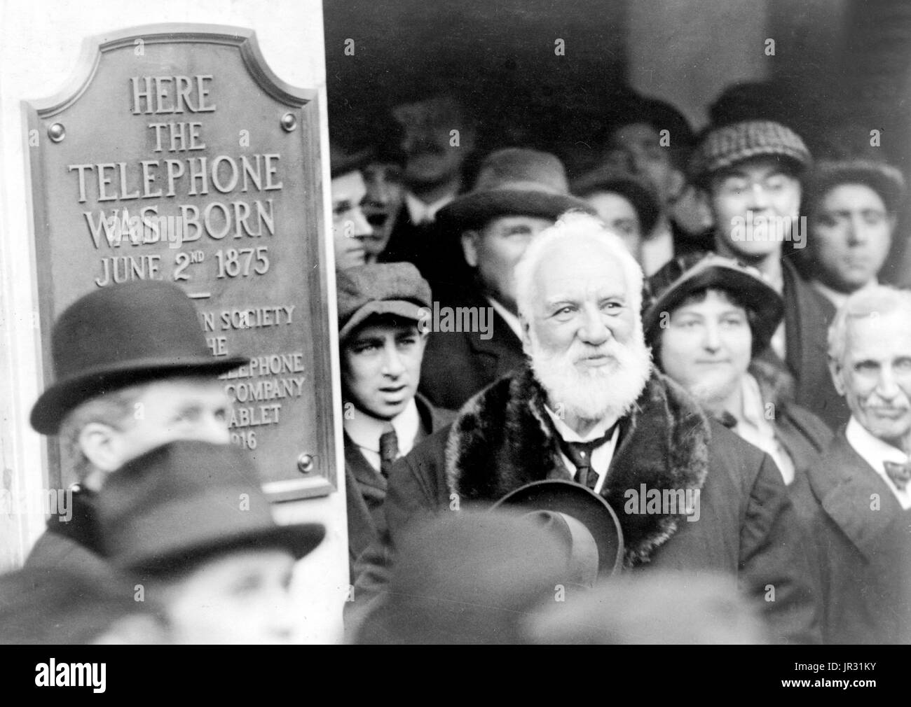 Bell at the unveiling of a plaque commemorating the 1876 invention of the telephone, Boston. Alexander Graham Bell (March 3, 1847 - August 2, 1922) was a Scottish-American speech therapist and inventor of the telephone. Bell followed his father and grandfather into the speech therapy profession, but also studied sound waves and the mechanics of speech. By 1871, he had moved to the United States, becoming professor of vodal physiology in Boston. There he performed his experiments in converting sound waves into electrical impulses for transmission down wires. In 1876, he patented the telephone a Stock Photo