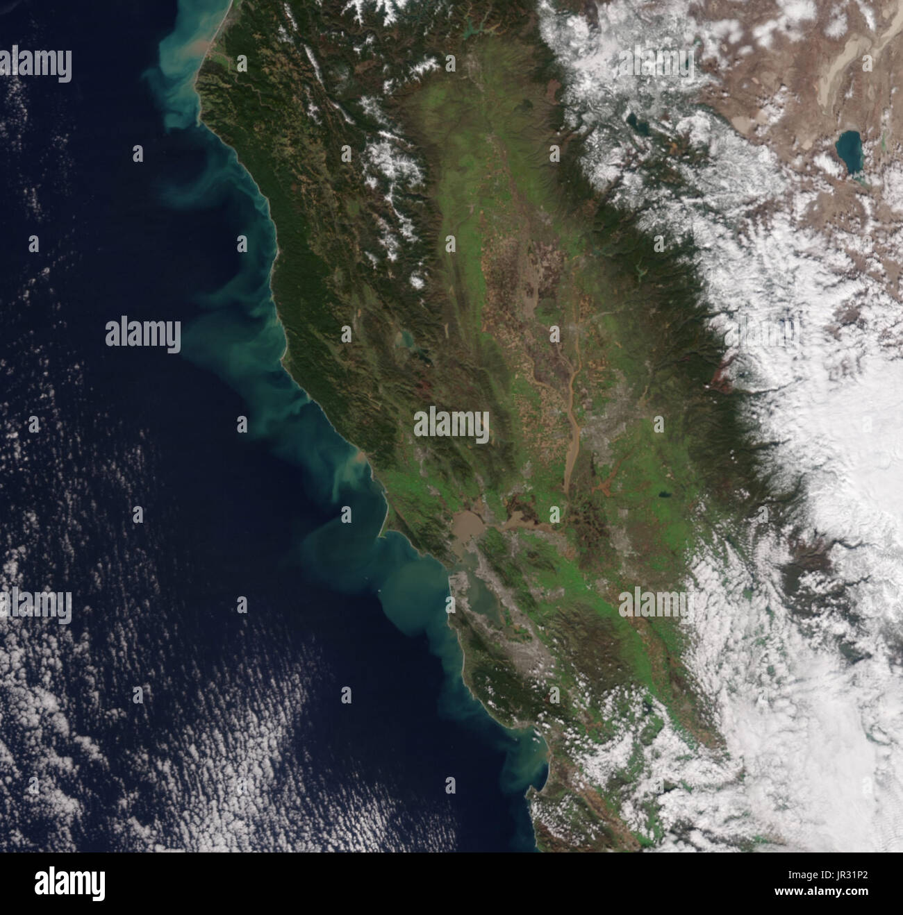 California coast on February 11, 2017, after a series of winter storms, as seen by the Visible Infrared Imaging Radiometer Suite (VIIRS) on the Suomi NPP satellite. Reservoirs are full, and overflowing rivers carry muddy sediment to the Pacific Ocean. Compare with JG5743, taken in November, 2016, before the rain. Stock Photo