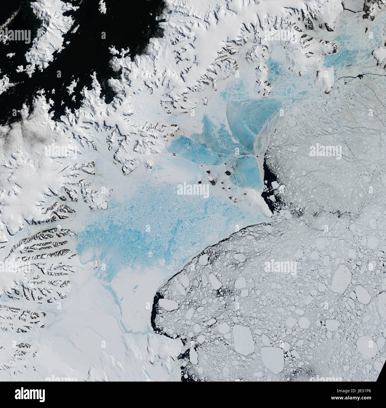 Northern part of the Larsen Ice Shelf, comprised of four natural-color satellite images captured by the Operational Land Imager (OLI) on Landsat 8 on January 6 and 8, 2016. Two large sections of the ice shelf have collapsed in recent years. Blue, meltwater-covered sea ice is now in the embayments where Larsen A and Larsen B once were. A remnant of Larsen B, now known as the Scar Inlet Ice Shelf, can still be seen to the south. Stock Photo