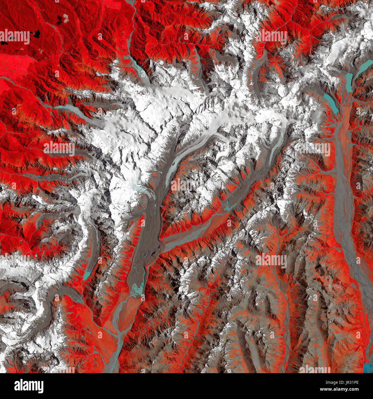 New Zealand's Tasman Glacier on December 30, 1990, taken by the Thematic Mapper on Landsat 4. Compare with JG5749 from 2017, to see how the glacier is receding. In this false-color image, white is snow and ice, red is vegetation, blue is water, and brown is soil (including moraines and sediment-covered glaciers). Stock Photo