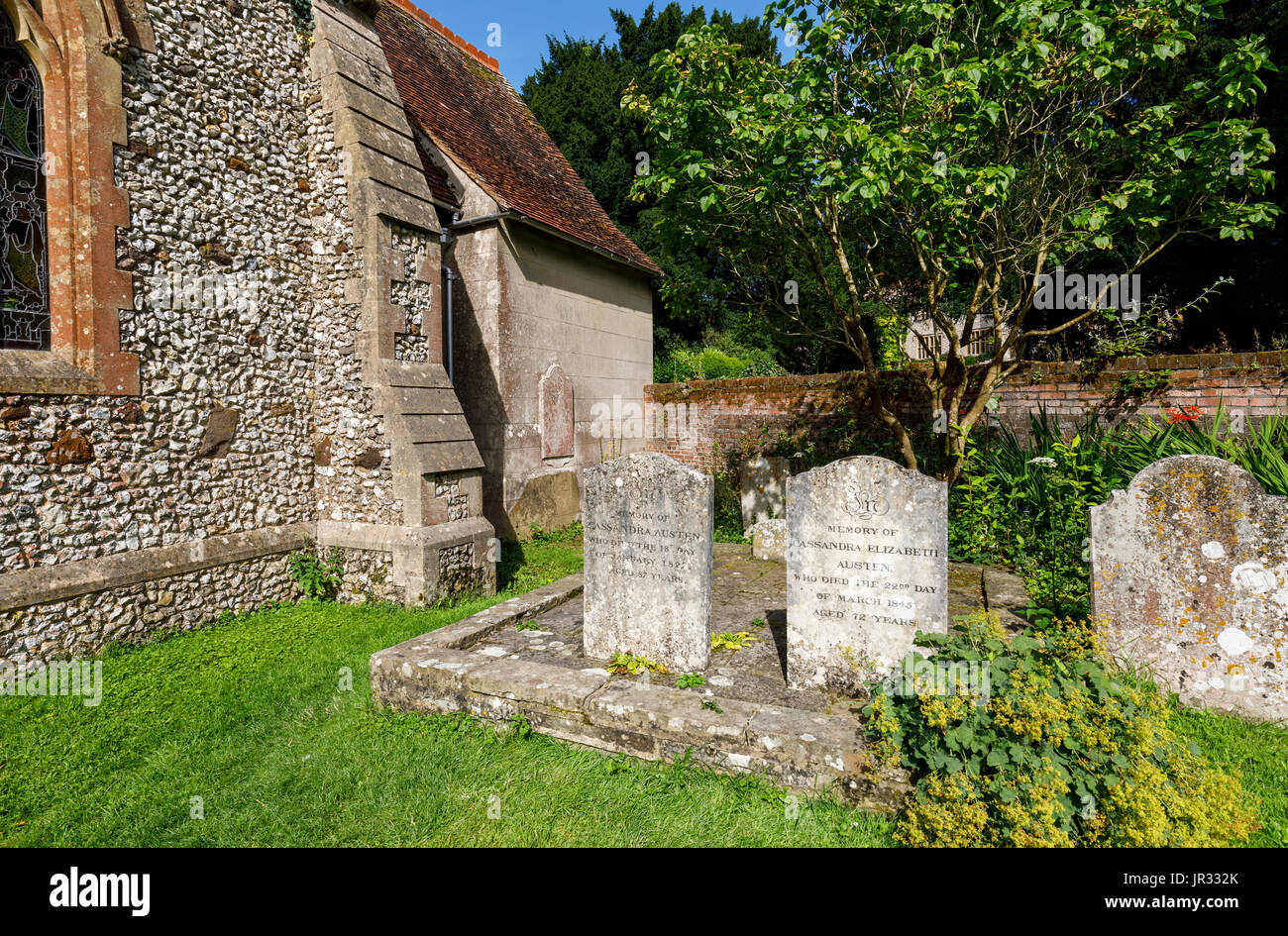 Gravestones of Jane Austen's mother and sister Cassandra in churchyard of the parish church of St Nicholas, Chawton, Hampshire, southern England, UK Stock Photo