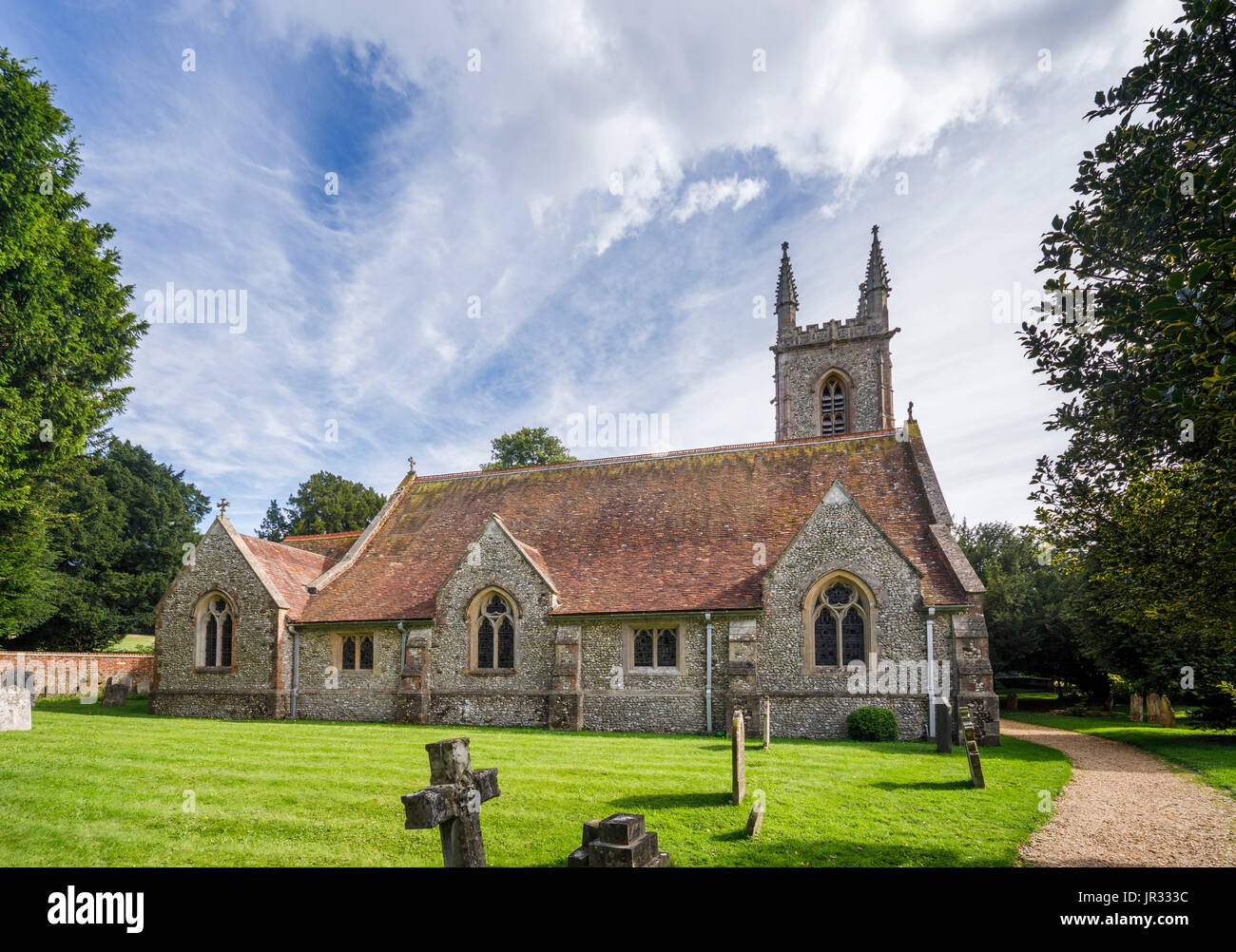 Churchyard and exterior of the parish church of St Nicholas, Chawton, Hampshire, southern England, UK, burial place of Jane Austen's mother and sister Stock Photo