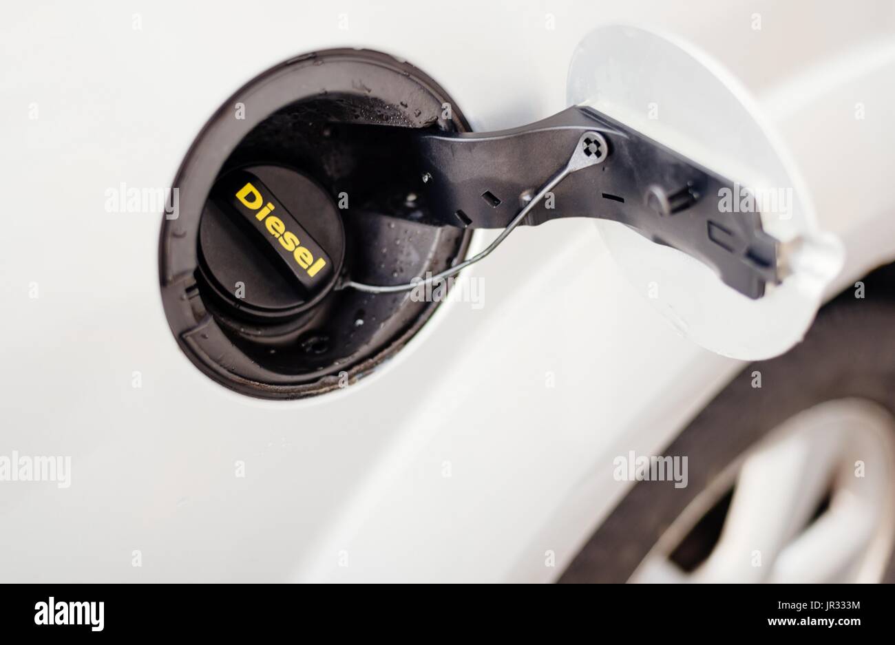 Diesel fuel cap in silver car. Petrol station Stock Photo