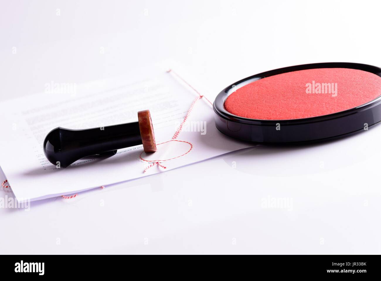 Notary public stamp, document, stamp pad on white background with