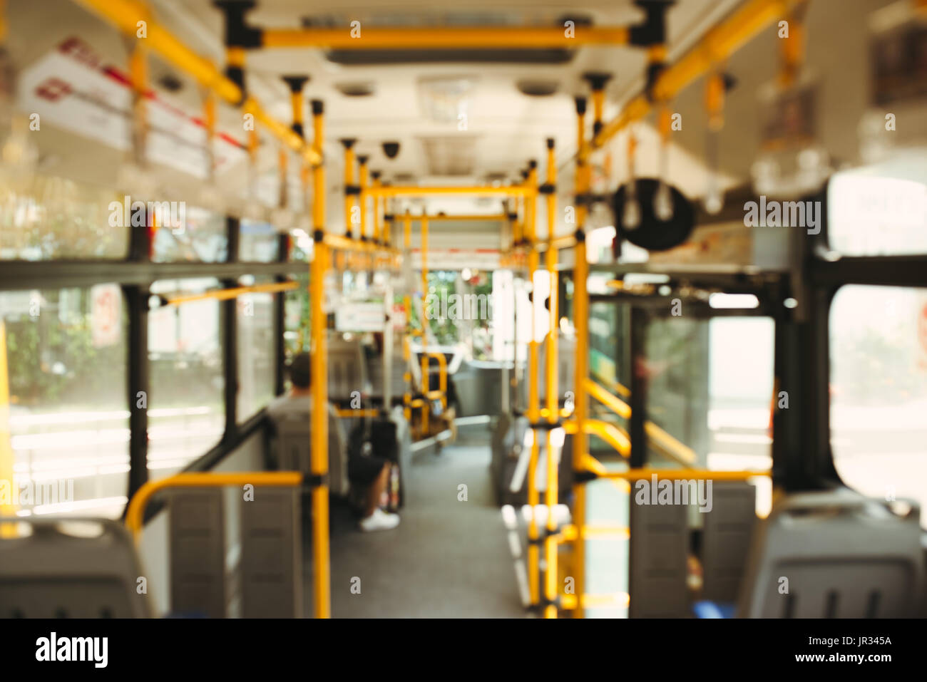 Public transportation. Blur image of interior of modern city bus Stock Photo