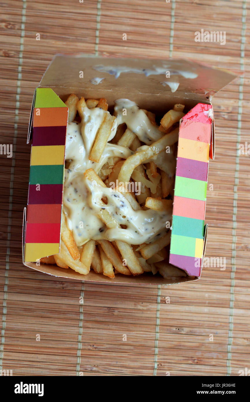 McDonald's Truffle Mayo & Parmesan Loaded Fries against bamboo