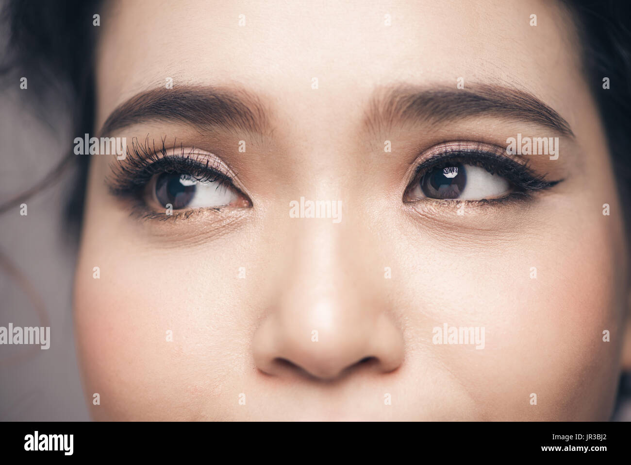 Asian model eye close-up with long eyelashes. Selective focus Stock Photo