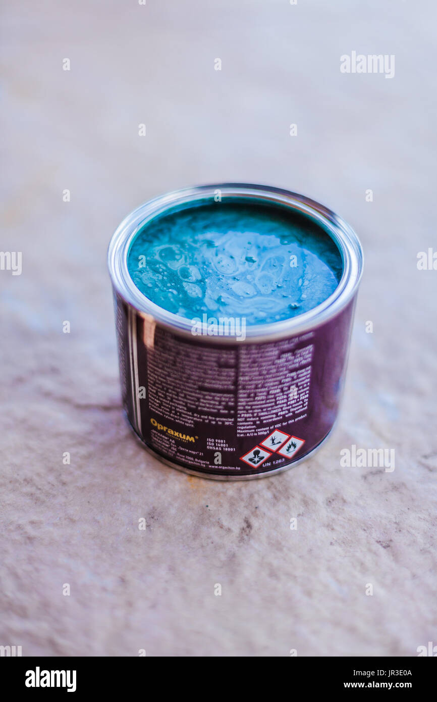 Open bucket of blue green paint isolated Stock Photo Alamy