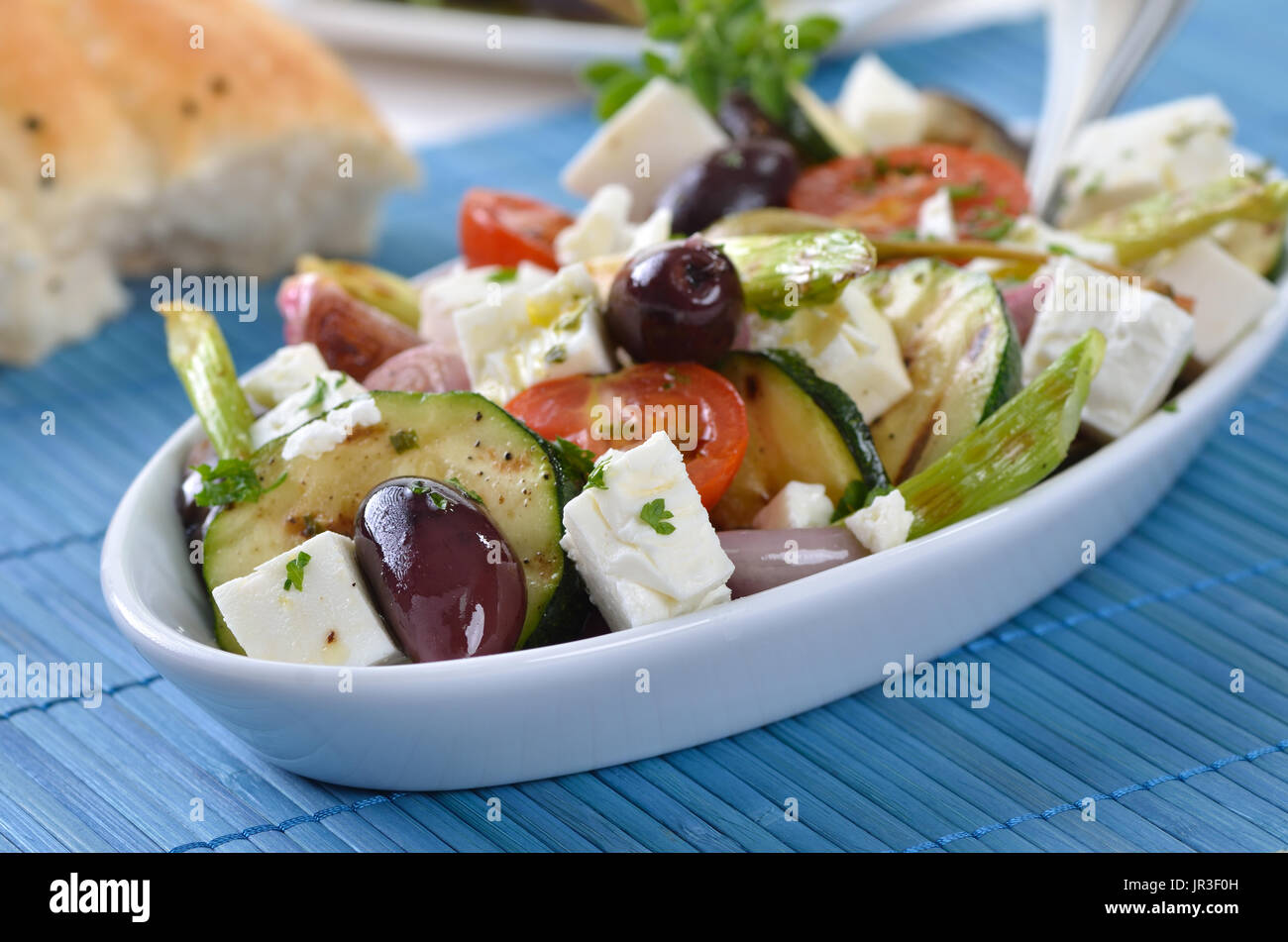 Greek fried vegetables with feta cheese and Kalamata olives, pita bread