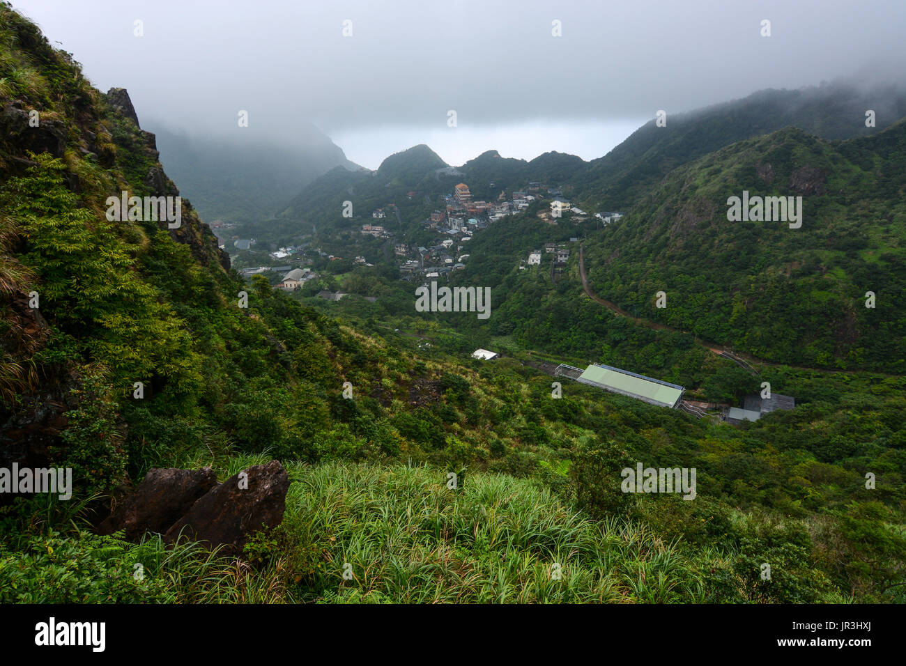 View over the Gold Ecological Park in Jiufen, Taiwan from a mountain hiking path overlook Stock Photo