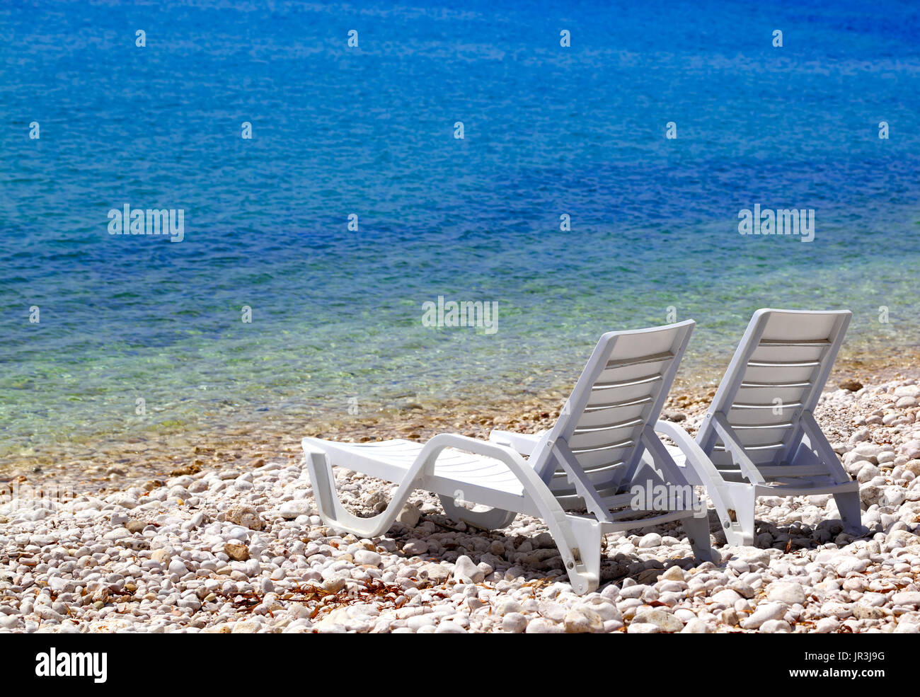 Deck chairs on beach hi-res stock photography and images - Alamy