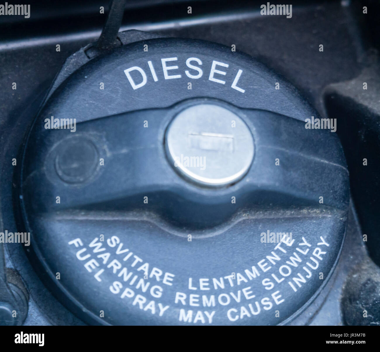 Close-up of a black plastic fuel filler cap of a diesel-powered car. Labeled 'Diesel'. Stock Photo
