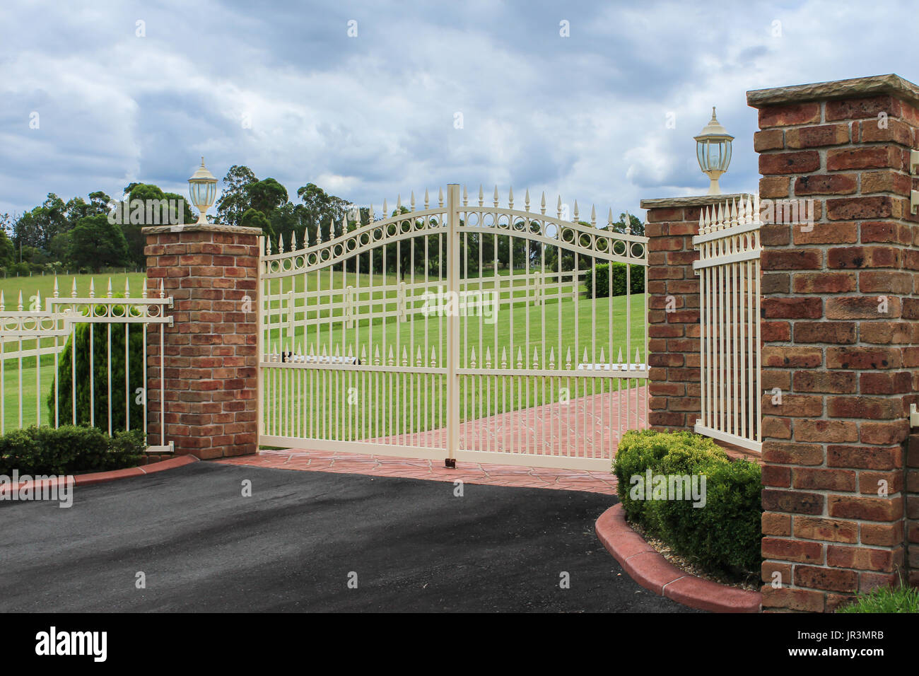 Metal Driveway Entrance Gates Set In Brick Fence With Garden Trees In Stock Photo Alamy,How To Cook A Prime Rib In The Oven