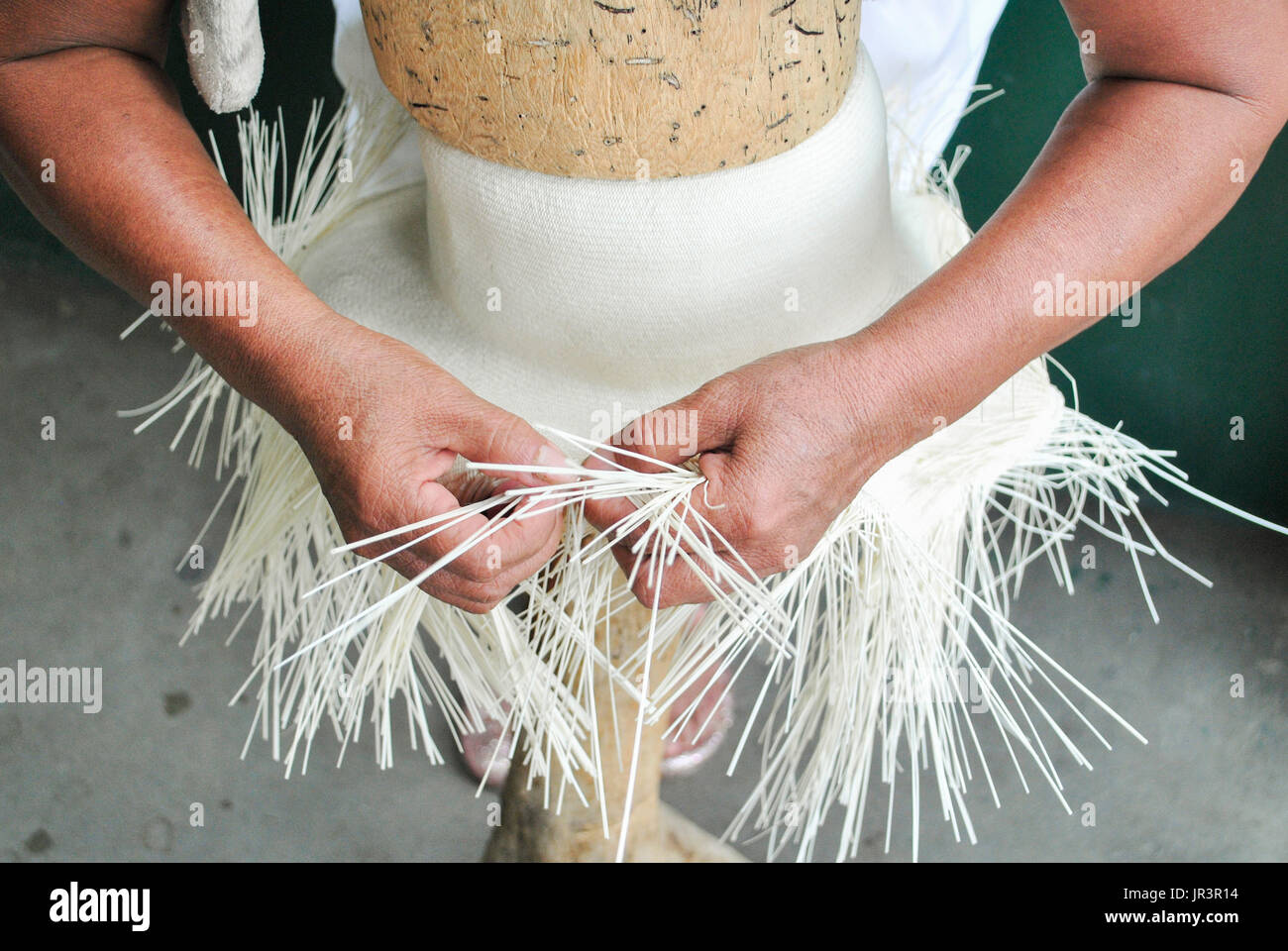 Weaving toquilla straw hat, known as Panama Hat. Brimmed straw hat of