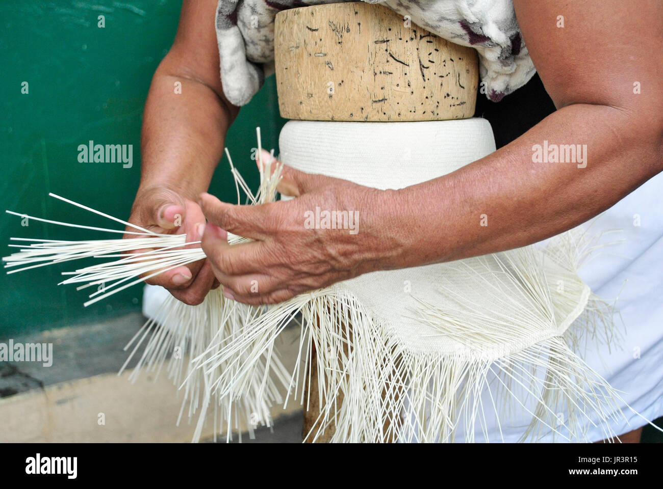 Weaving toquilla straw hat, known as Panama Hat.  Brimmed straw hat of Ecuadorian origin.  Montecristi.  Ecuador. Stock Photo