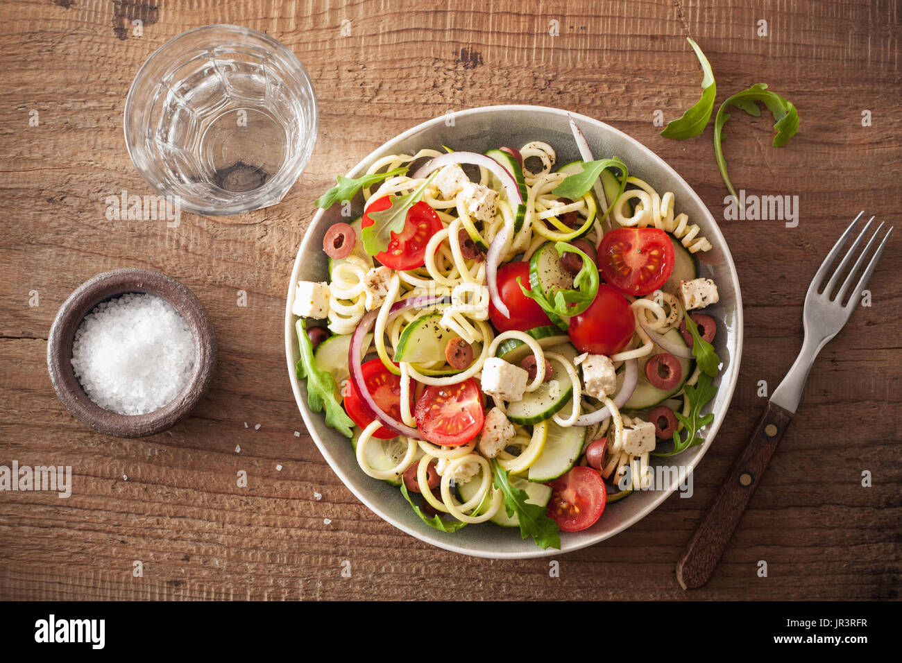 spiralized courgette salad greek style with tomato feta olives cucumber Stock Photo