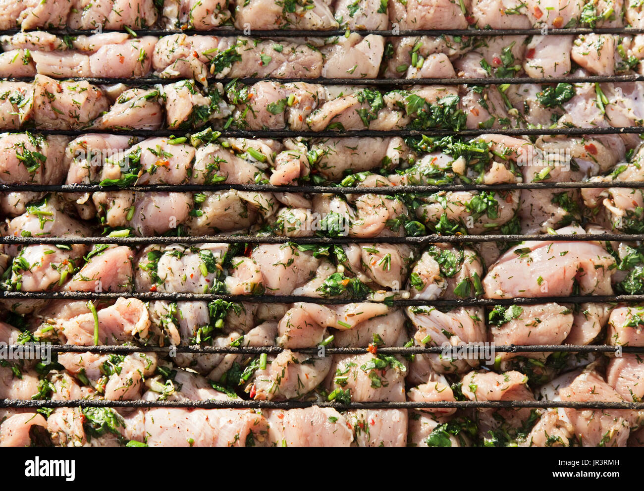 Raw Chicken Meat With Green, Preparated For Grill Outdoors. Stock Photo