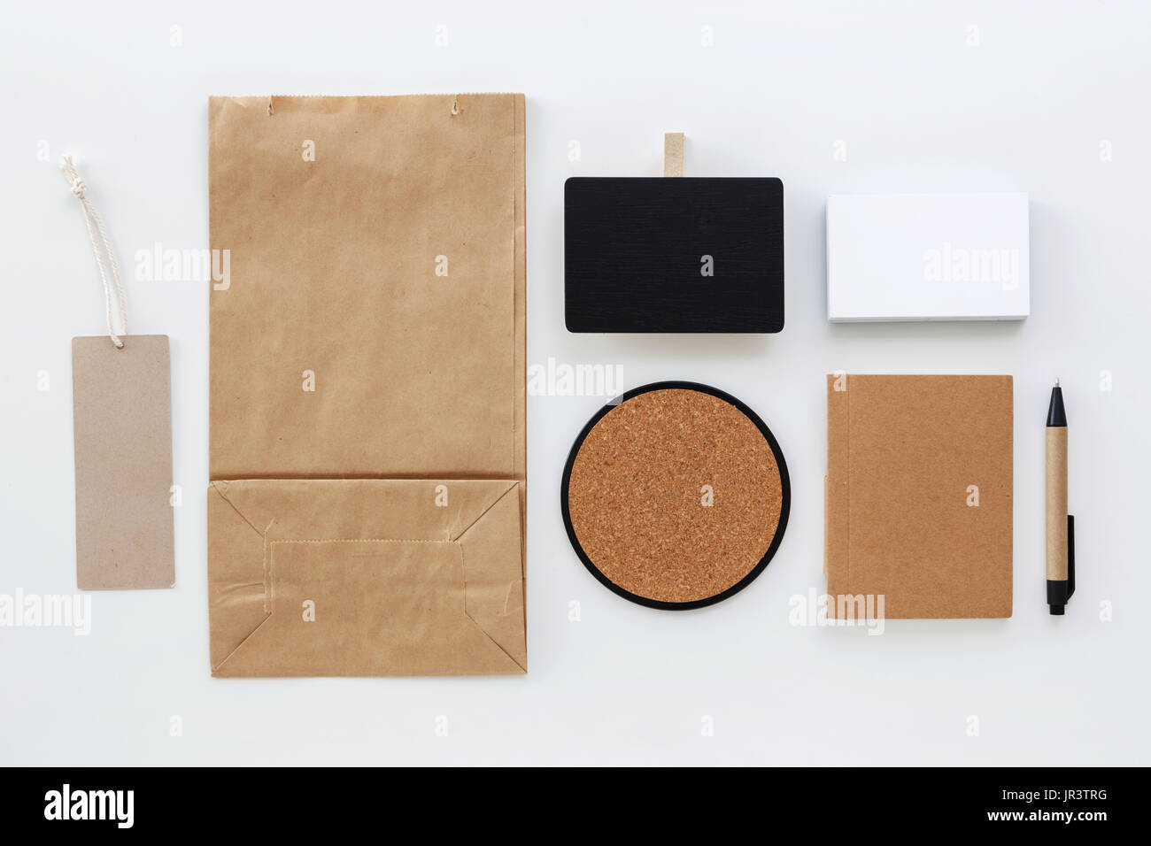 Paper bag and business card with price tag stationery mockup Stock