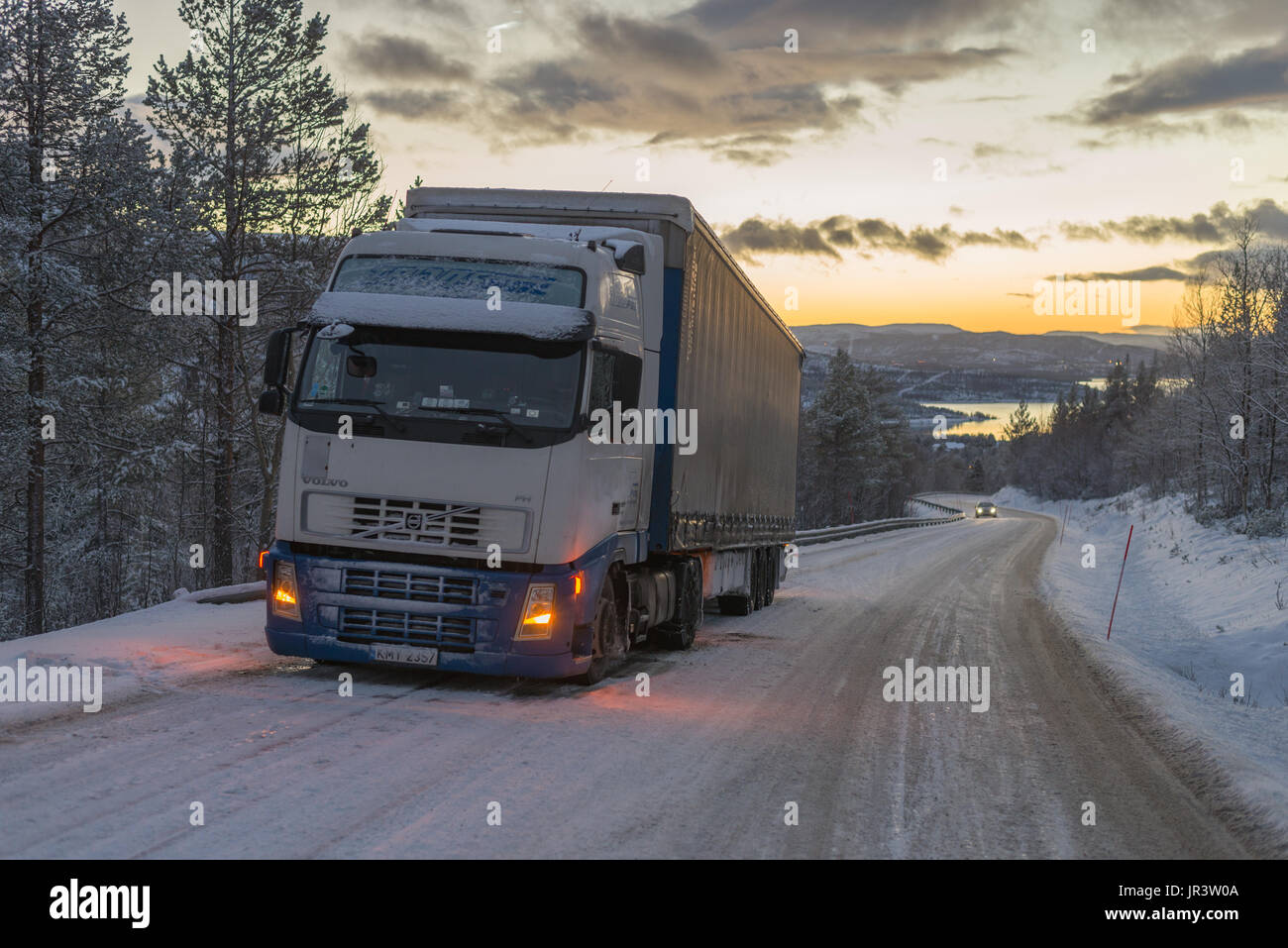 big truck stuck on ice road in winter Stock Photo