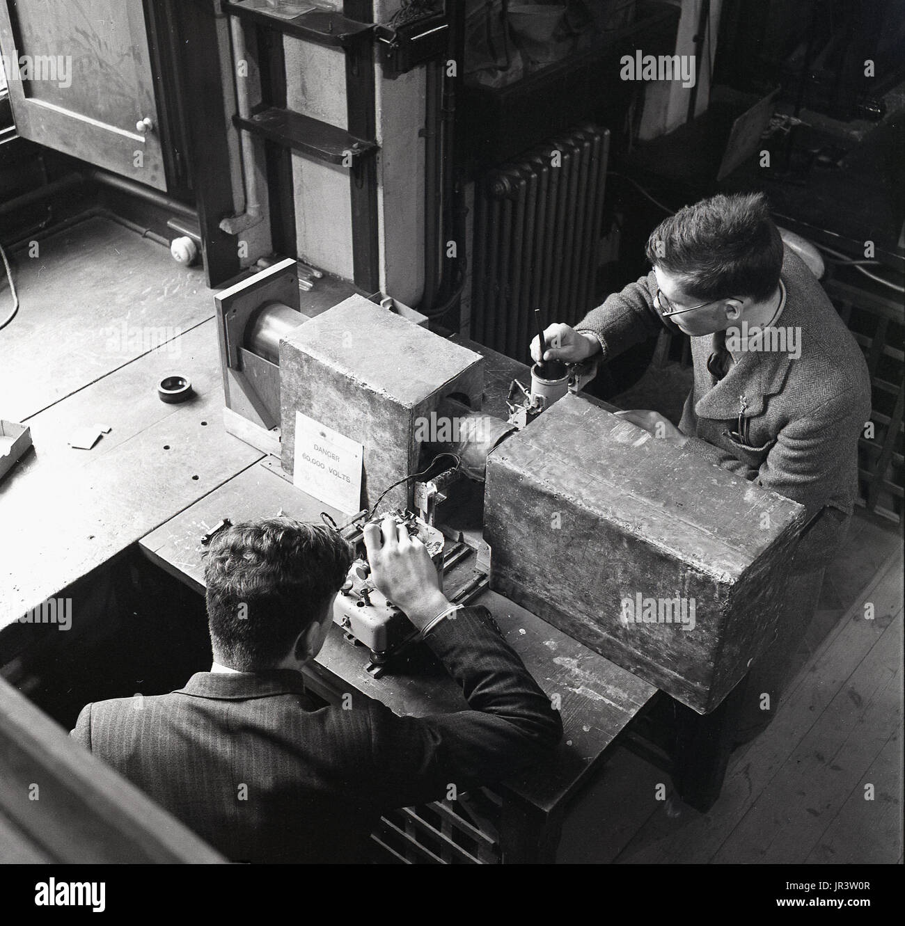 1948, historical, a view from above, two male science students at Oxford University, Oxford, England, UK, inside a room, doing experiments in crystallography, the science that examines crystals, the study of atomic and molecular structure. Stock Photo