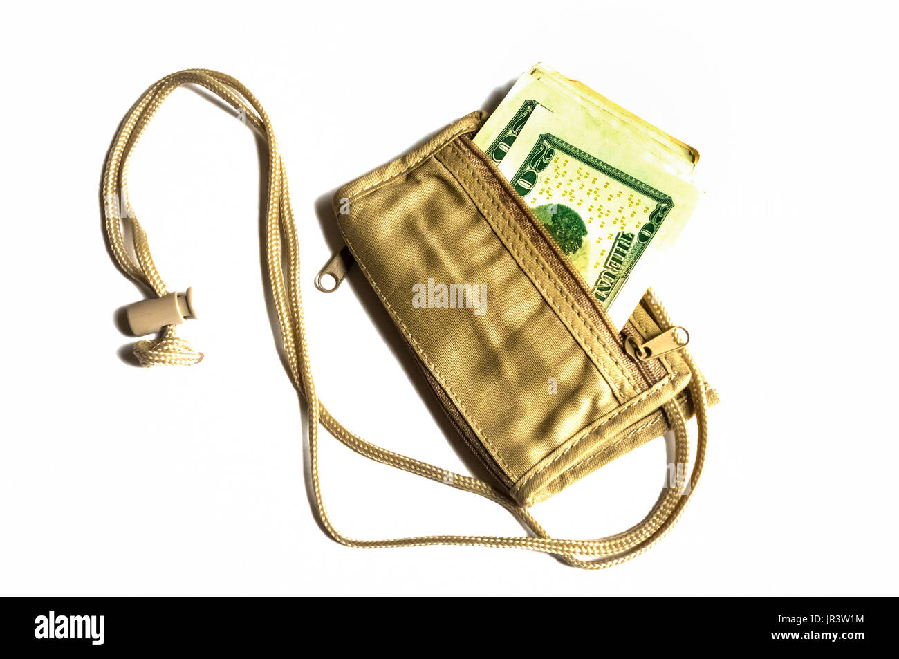 A tan neck wallet filled with US bank notes on a white background Stock Photo