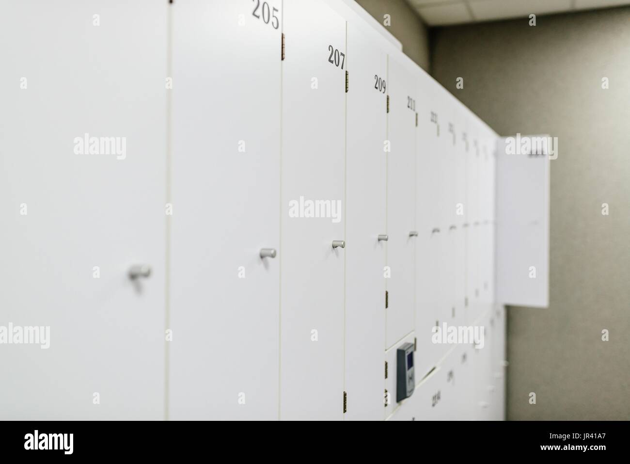 White change room lockers with electronic access control Stock Photo