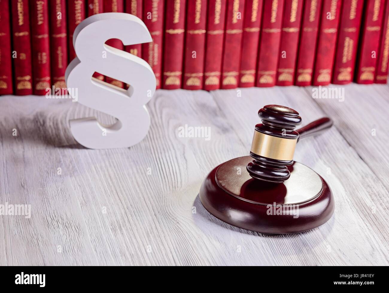 Symbols of law in court library. Judge gavel, wooden paragraph and ...