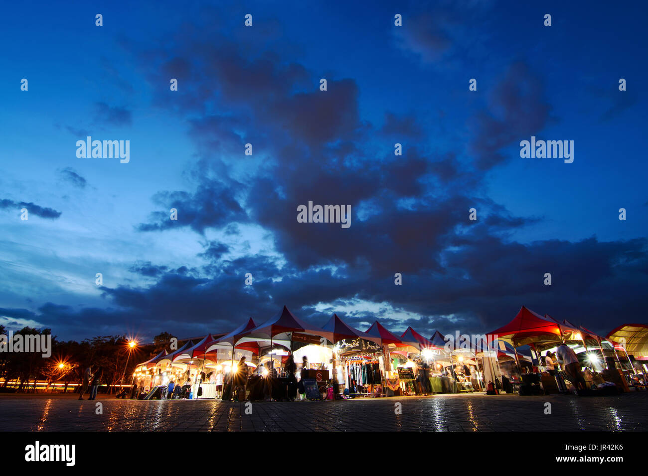 Taipei, Taiwan - JULY 2, 2017 - Vendor tents from the annual Taipei Vegan Frenzy draw food lovers after sunset Stock Photo