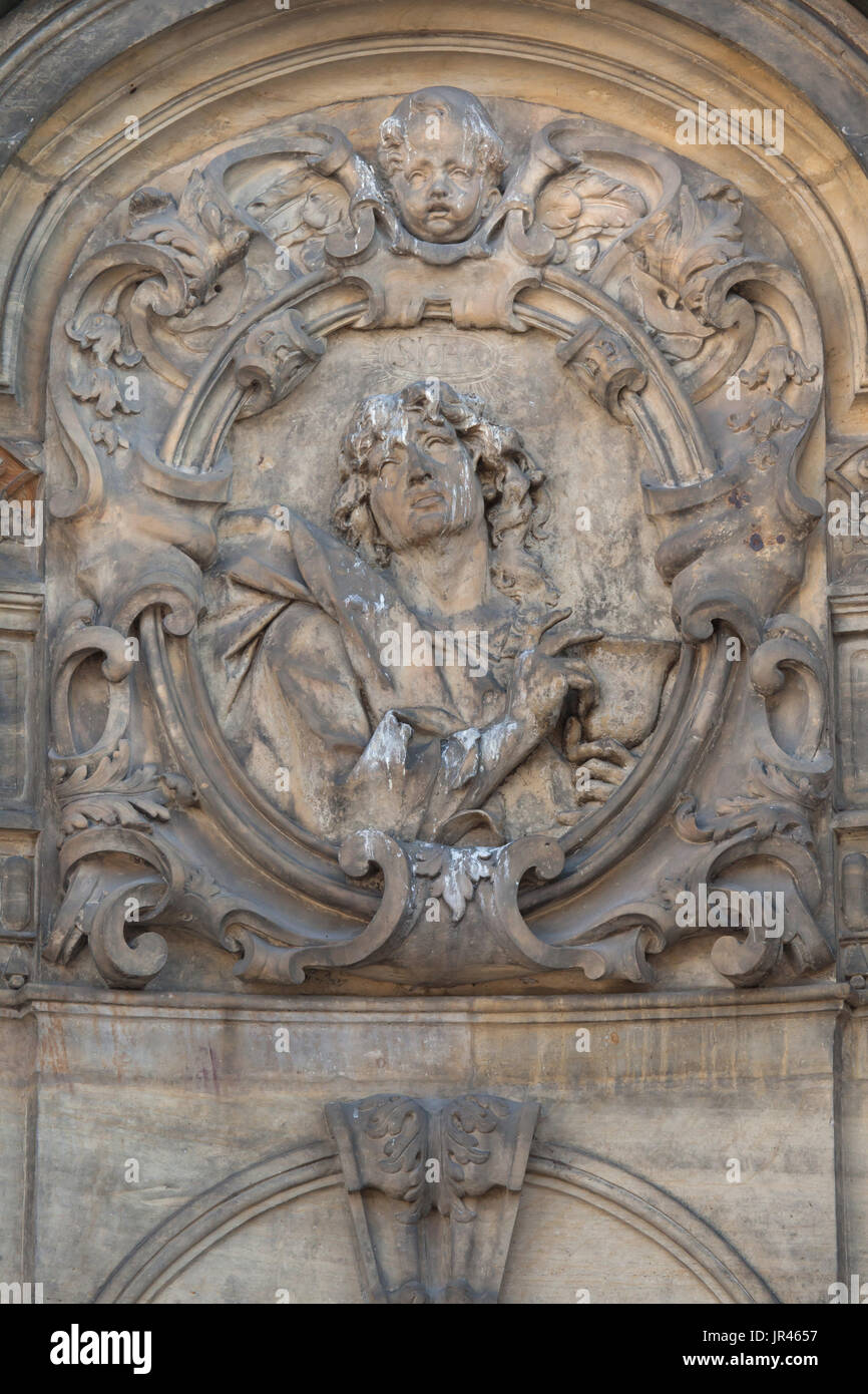 Saint John the Evangelist depicted on the Holy Trinity Column (Sloup Nejsvětější Trojice) in Olomouc, Czech Republic. Stock Photo
