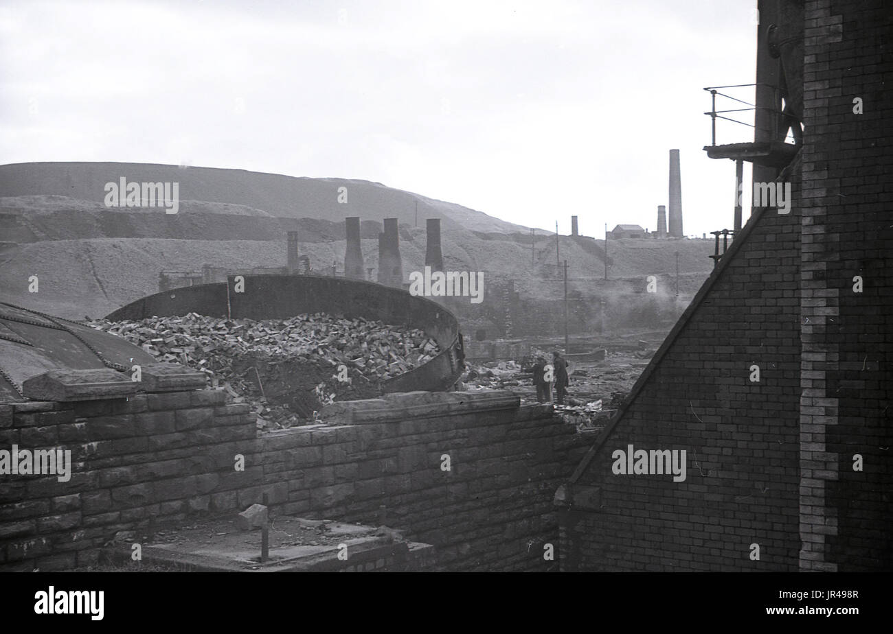 1940s, historical, picture shows the furnaces and buildings of the famous Dowlais Ironworks on the hillside overlooking Merthyr Tydfil being demoiished. Stock Photo
